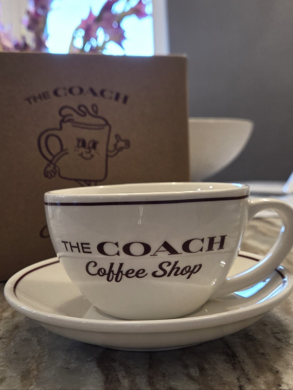 Coach Coffee Shop Ceramic Cup & Saucer in Cream and Brown
